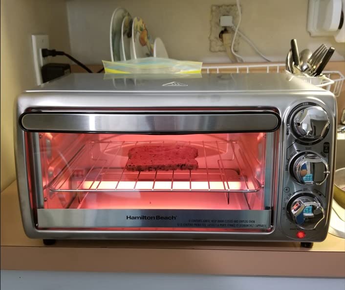 Hamilton Beach 4-Slice Toaster Oven with 5 Cooking Modes (Bake, Broil, Keep Warm Toast & Bagel) with Stay On & Auto Shutoff, 2 Rack Positions, 1100 Watts and 3 Accessories, Stainless Steel (31143) customer photo 2