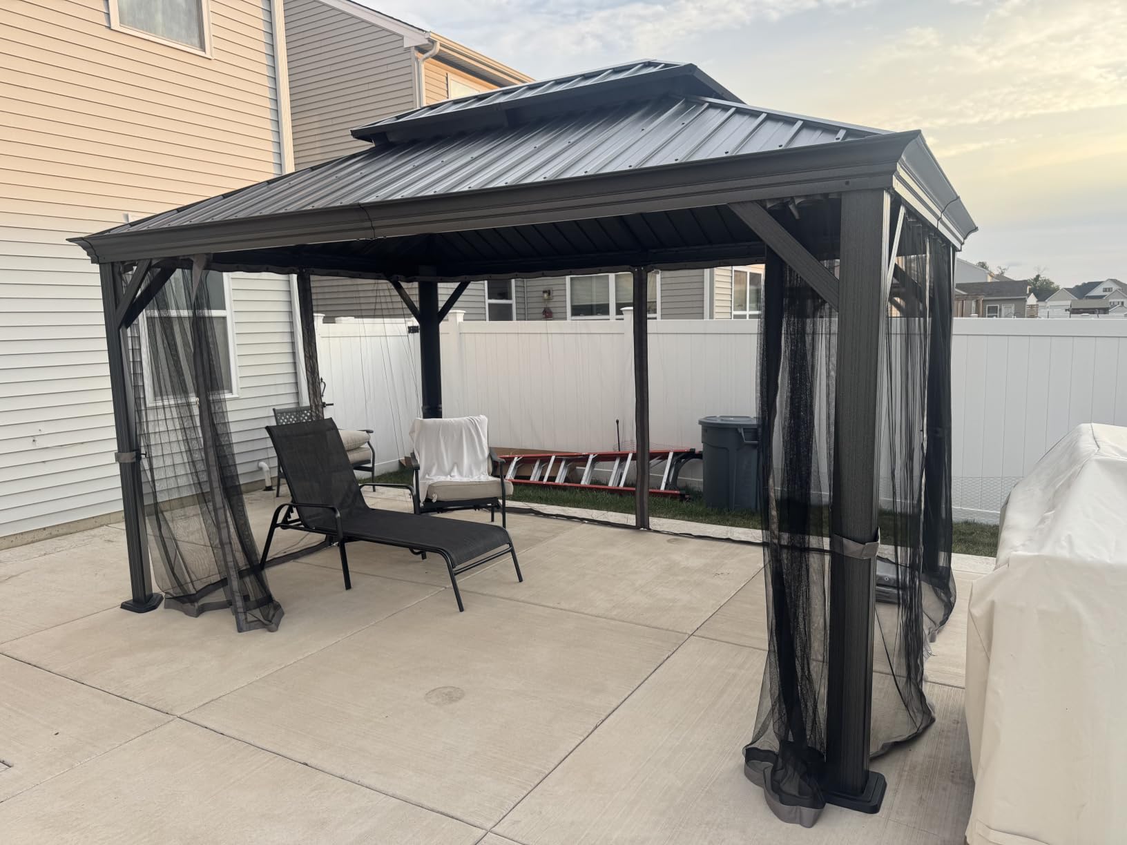 Kozyard Alexander Hardtop Aluminum Permanent Gazebo with a Mosquito Net and Privacy Sidewalls (Alexander 12'x14' (Brown) customer photo 1