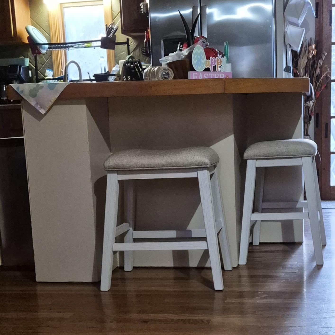 Signature Design by Ashley Skempton Counter Height Bar Stool, Set of 2 | Space-saving 24-inch farmhouse design, Supportive 18.5-inch foam-cushioned saddle seat, Distressed wood frame with footrest customer photo 2