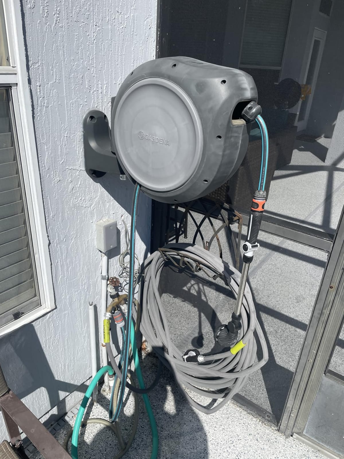 GARDENA Retractable Garden Hose Reel - 100 Feet - Auto Retract Hose Reel with 180° Swivel Wall Mount - Heavy Duty - Includes Spray Nozzle - 08055 customer photo 2