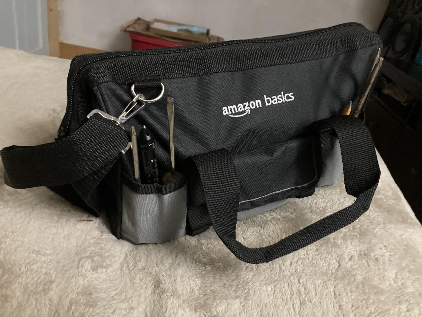 Amazon Basics Durable Wear-Resistant Tool Storage Bag with Adjustable Shoulder Strap, Portable Tool Organizer, 16 Pockets, 12 in, Black & Gray customer photo 1